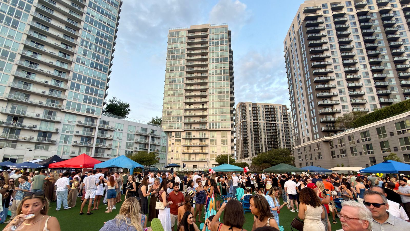 Summer block party on the lawn between Harbor Point residential towers in Stamford